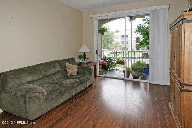 10550 Baymeadows Road, Unit 721 Jacksonville, FL 32256 - Photo 7 of 21 Living room out to Patio
