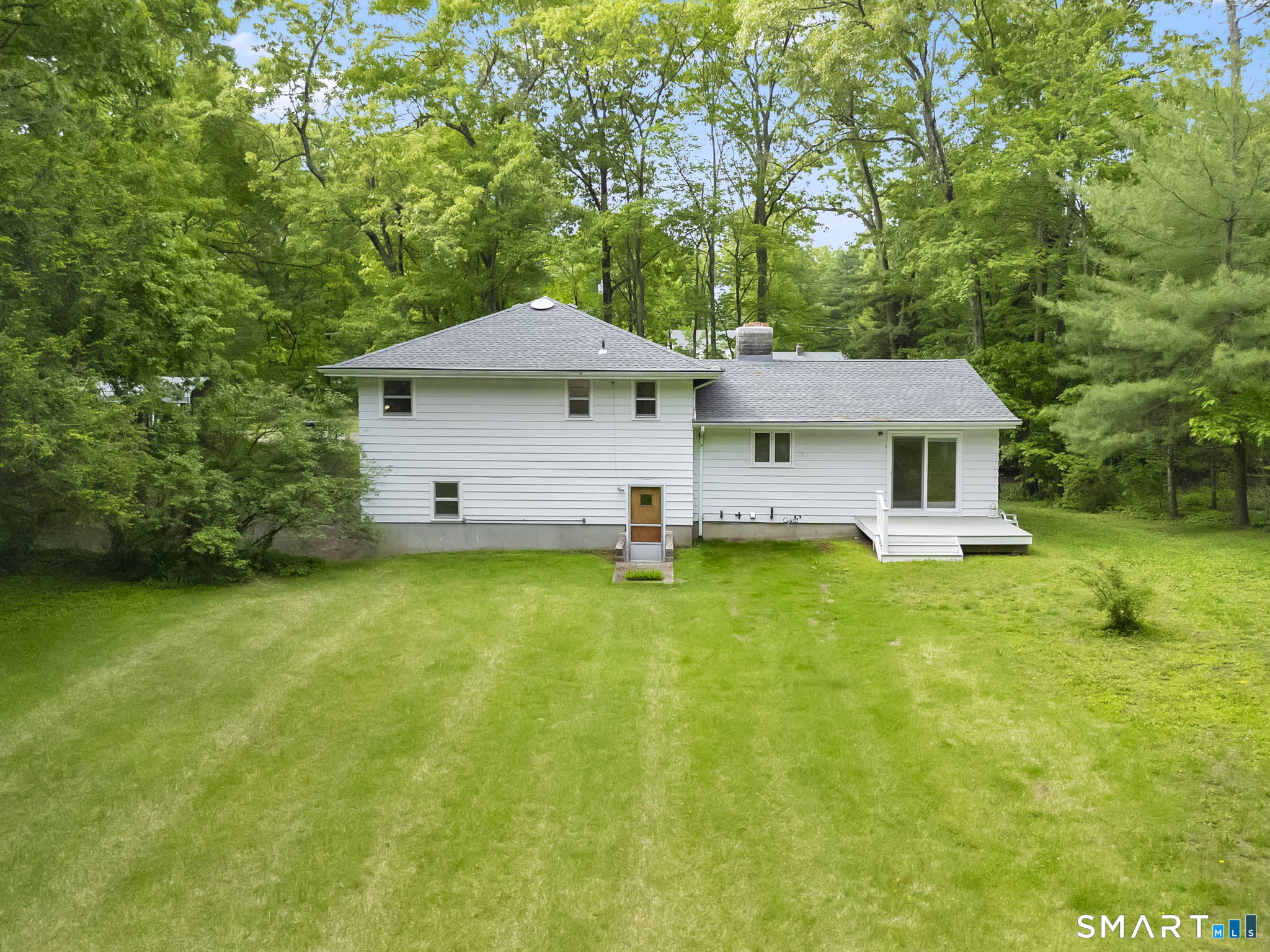 158 Notch Road Granby, CT 06035 - Photo 32 of 40 a front view of a house with a garden