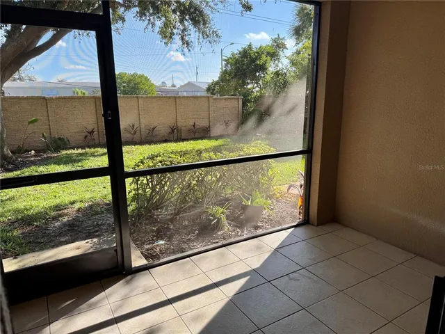a view of a back yard from a balcony