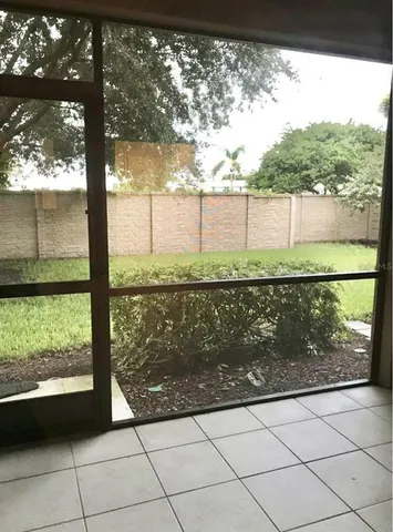 a view of a yard from a balcony