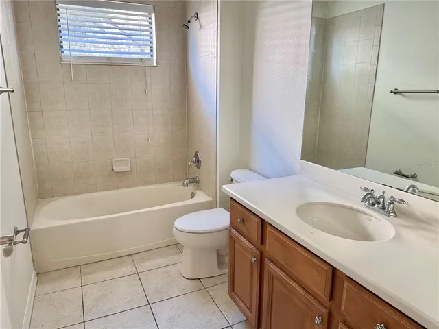 a bathroom with a sink a toilet and a bathtub