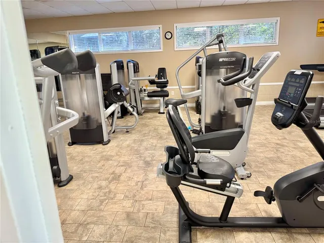 a view of a kitchen with furniture and natural light
