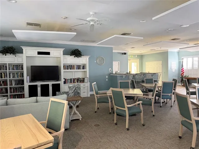 a view of a livingroom with furniture and a window