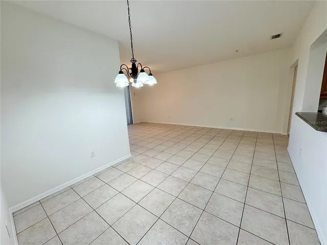 a view of an empty room with a mirror