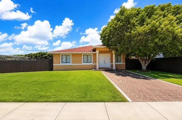 a house view with a garden space