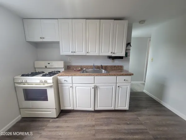 a view of cabinets with wooden floor