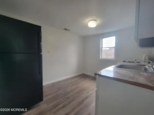 a kitchen with a sink and a window