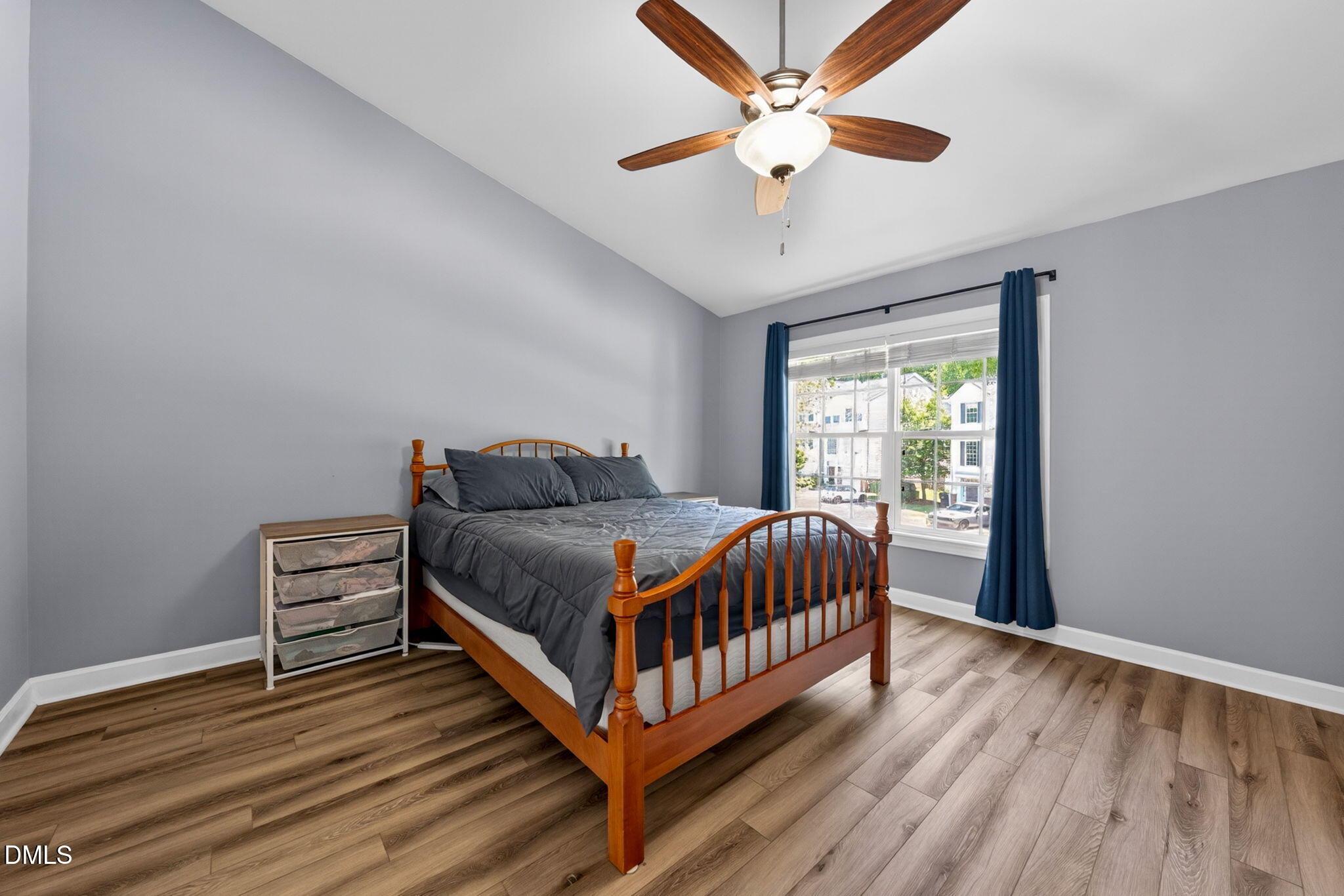 5500 Vista View Court Raleigh, NC 27612 - Photo 25 of 38 a bedroom with a bed and a ceiling fan