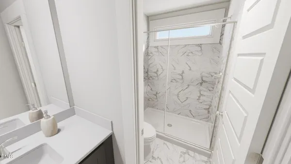 a bathroom with a bathtub and shower