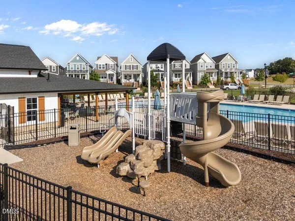 a view of a chairs and table in patio