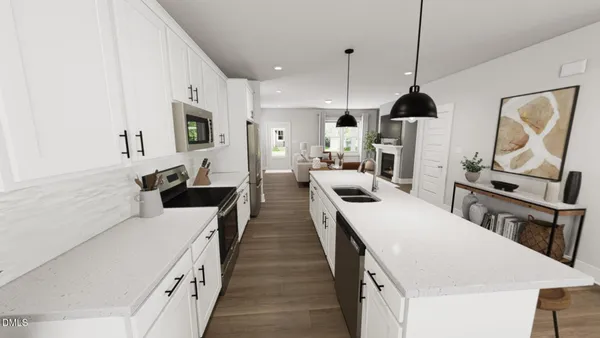 a large kitchen with stainless steel appliances lots of counter space and wooden floor