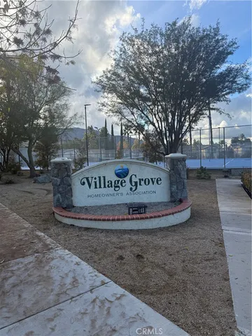 a view of outdoor space with signage and flags