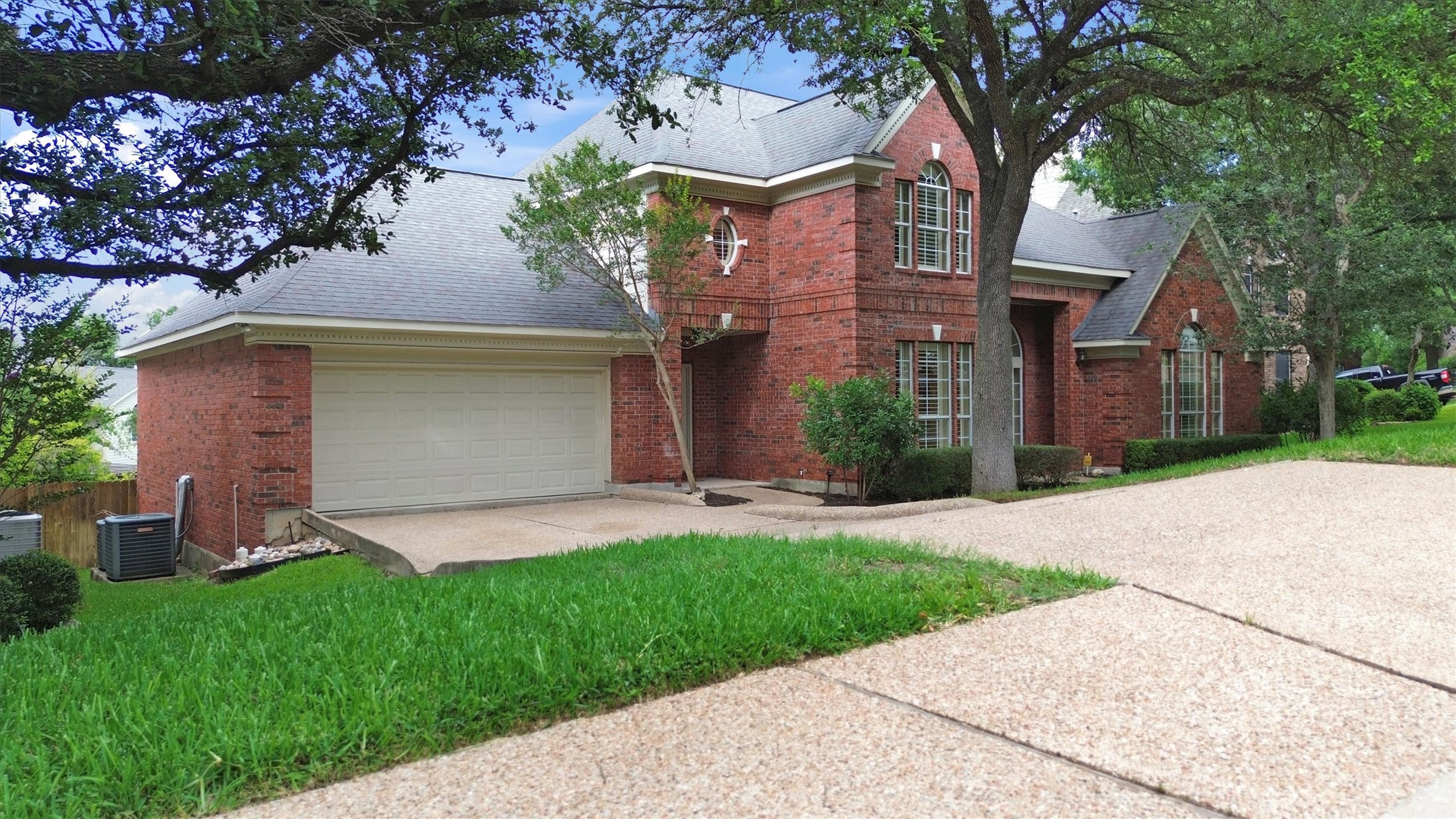 6008 Tributary Ridge Court Austin, TX 78759 - Photo 35 of 36 well-maintained and attached garage with mature shade trees.