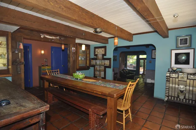 a room with kitchen island granite countertop furniture and a fireplace