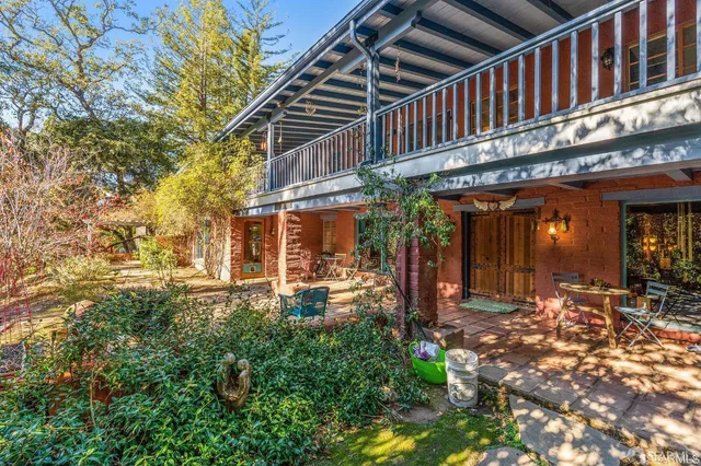 a view of a building with sitting area