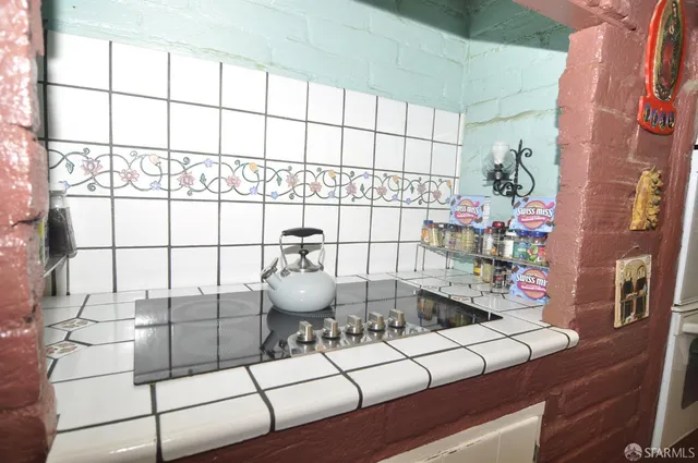 a kitchen with a sink and a stove