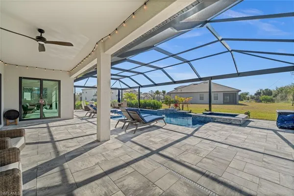 a view of a swimming pool with a patio