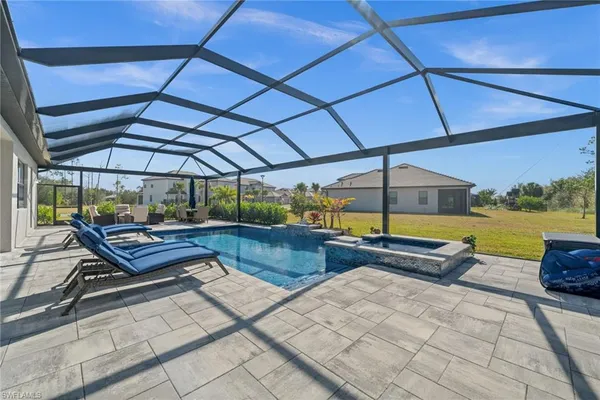 a view of a swimming pool with a patio