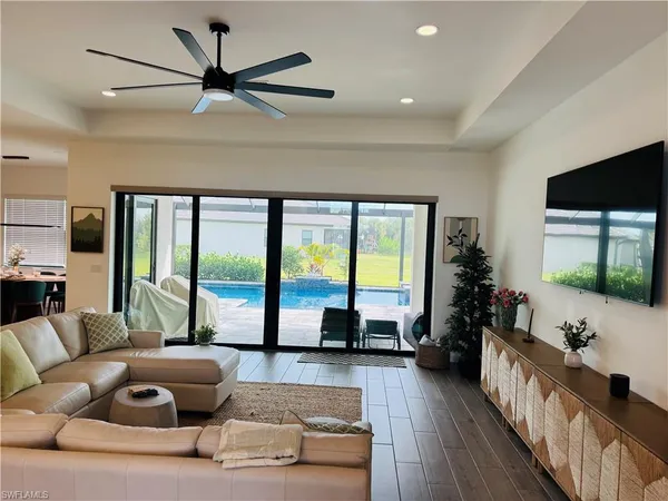a living room with furniture and a large window