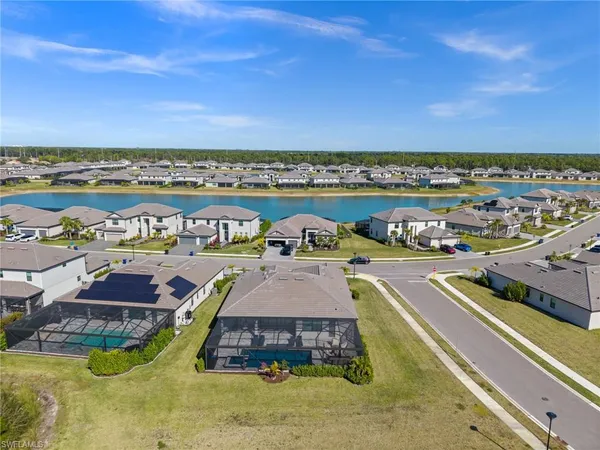 a view of swimming pool with outdoor seating and city view