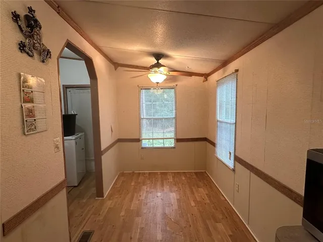 a kitchen with stainless steel appliances a refrigerator and a stove