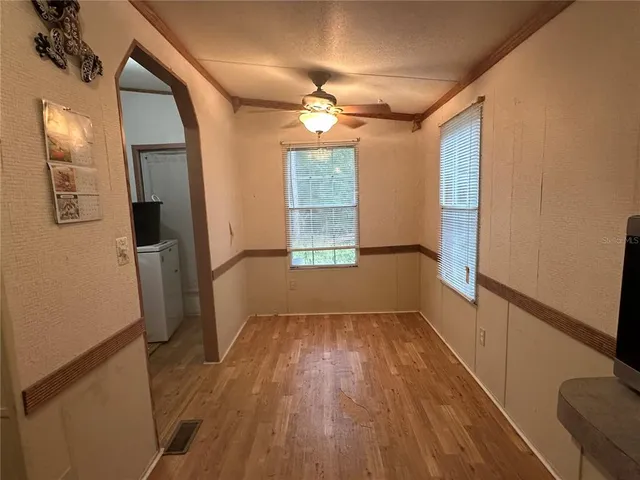 a kitchen with stainless steel appliances a refrigerator and a stove