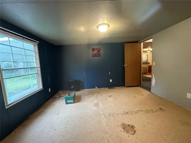 a view of workspace with wooden floor windows and piano