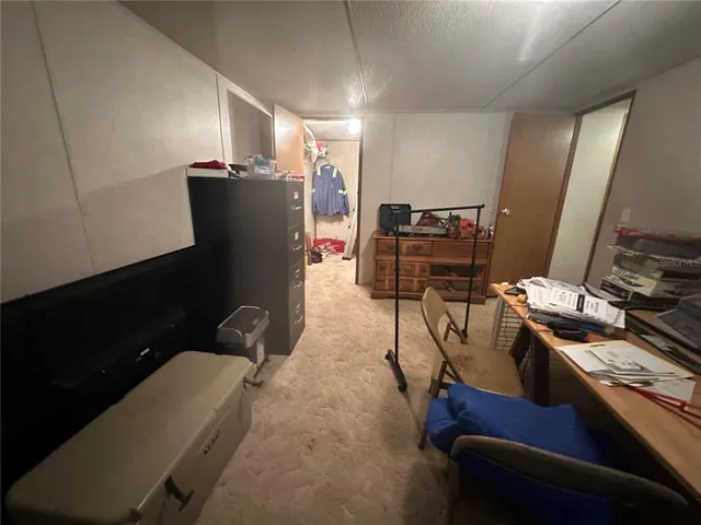 a view of a backyard with swimming pool