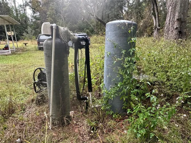 a view of outdoor space with deck and yard