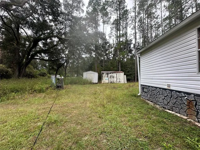 a view of a pool with a yard