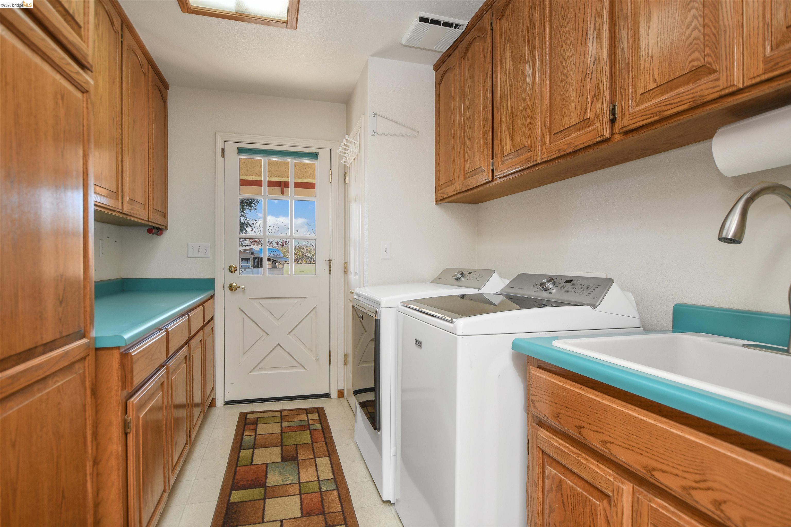 23751 Marsh Creek Road Brentwood, CA 94513 - Photo 16 of 49 a utility room with dryer and washer