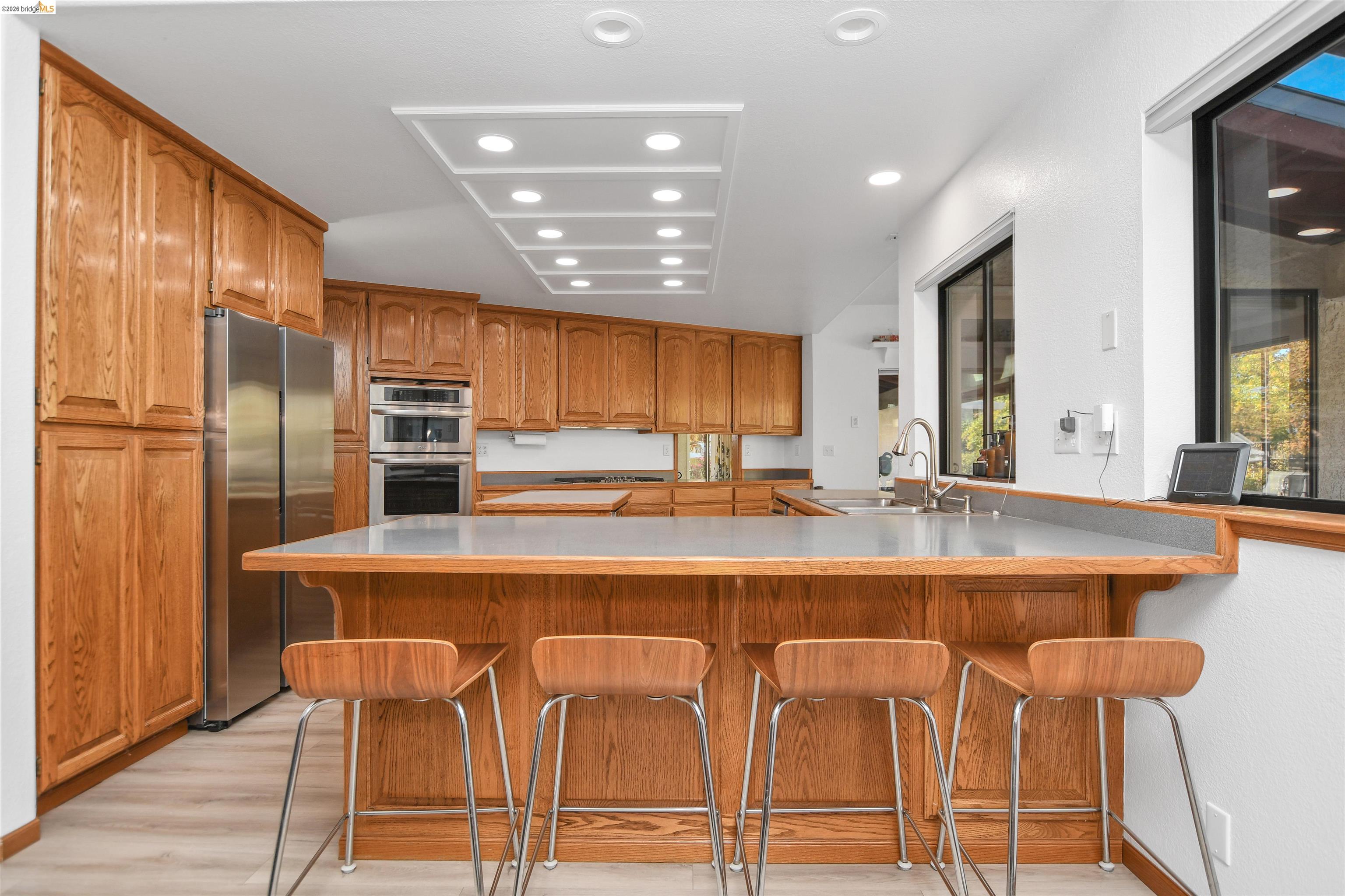 23751 Marsh Creek Road Brentwood, CA 94513 - Photo 19 of 49 a large kitchen with a table and chairs