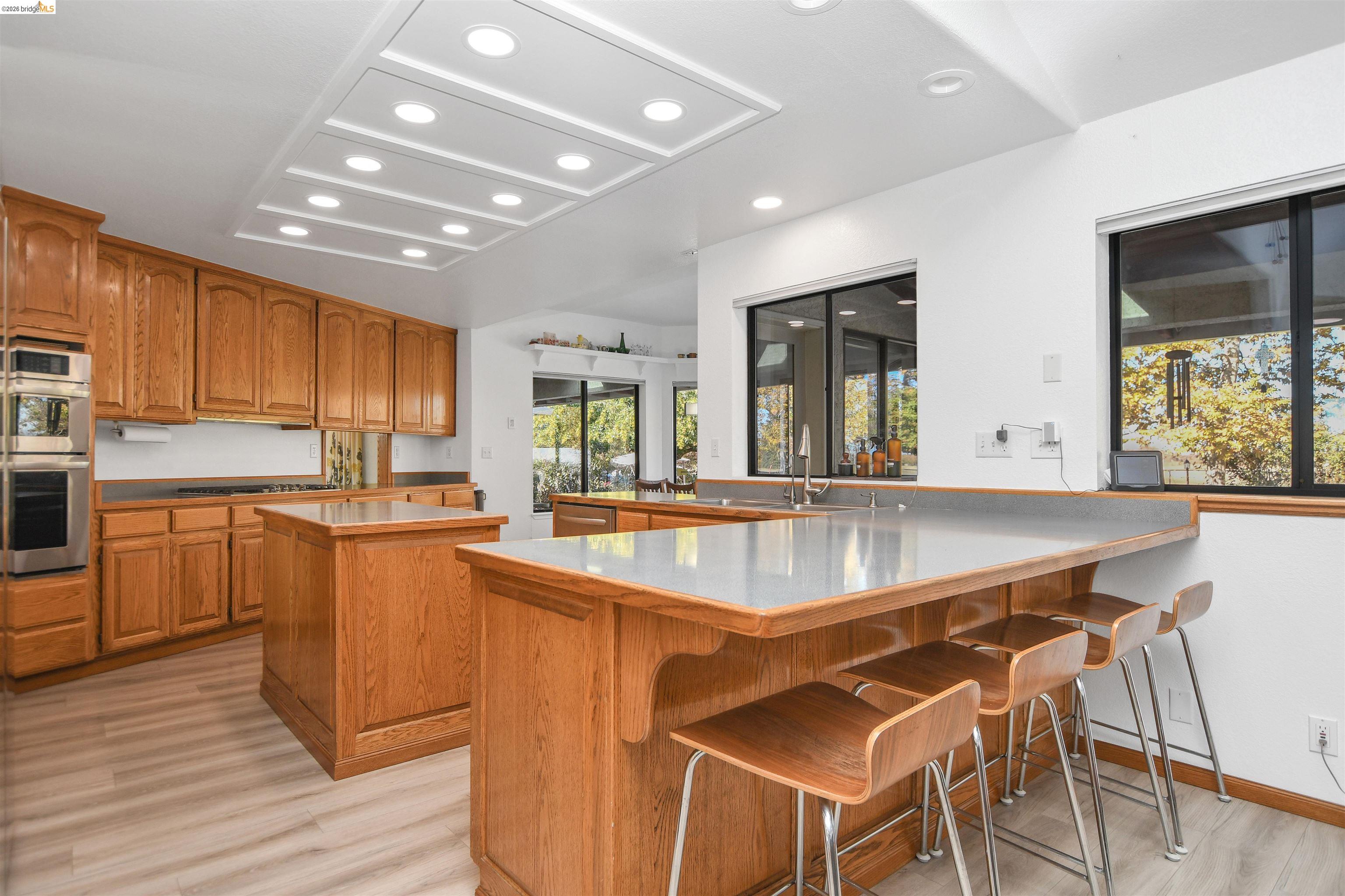 23751 Marsh Creek Road Brentwood, CA 94513 - Photo 20 of 49 a large kitchen with lots of counter space a sink and appliances