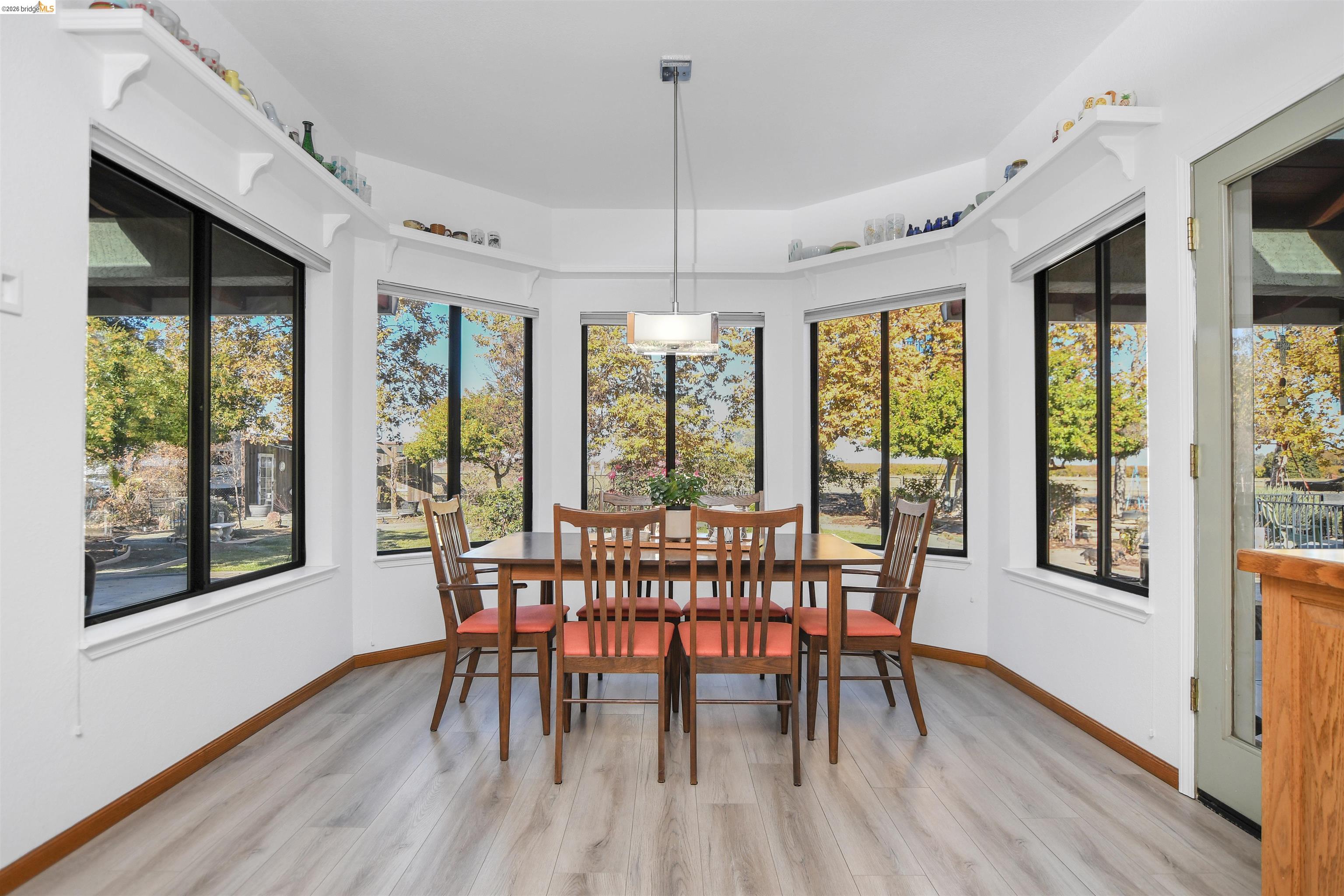 23751 Marsh Creek Road Brentwood, CA 94513 - Photo 22 of 49 a view of a dining room with furniture window and wooden floor