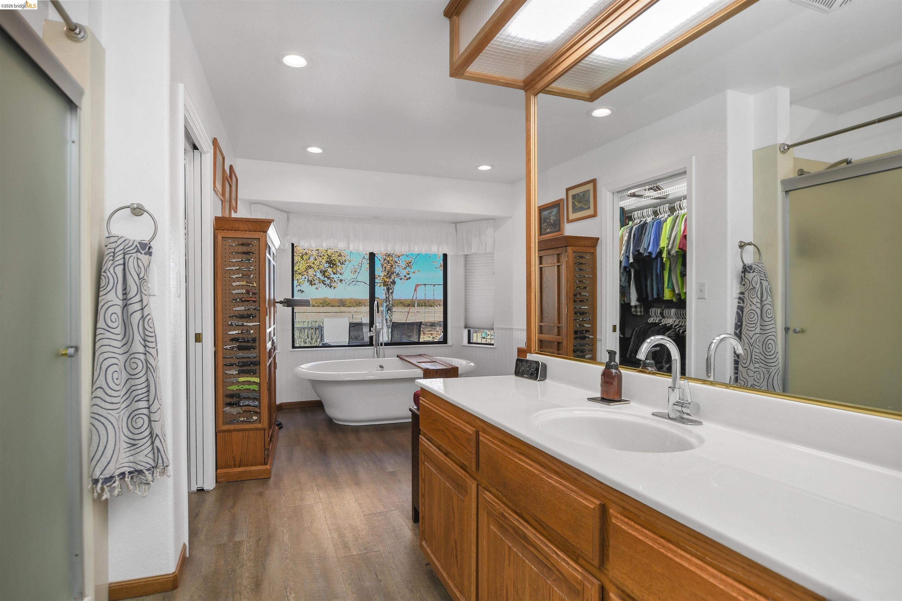 23751 Marsh Creek Road Brentwood, CA 94513 - Photo 28 of 49 a bathroom with a double vanity sink toilet and shower