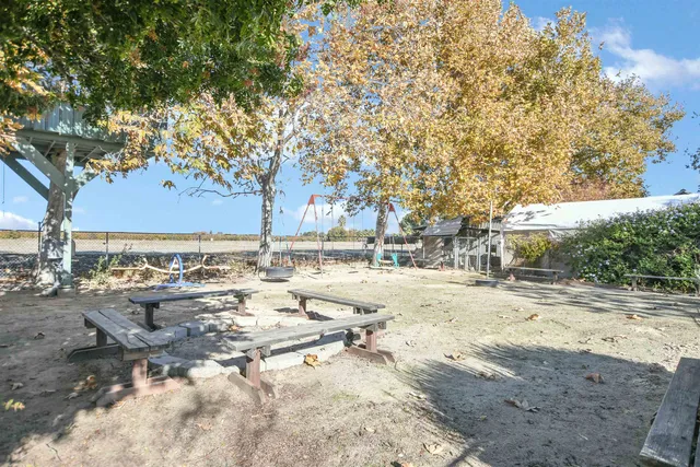 a big yard with large trees