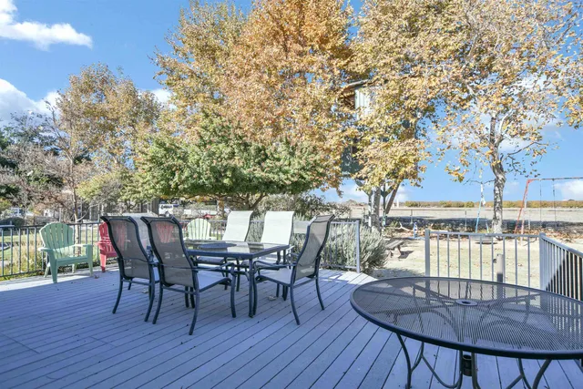 a view of yard with tree in the background