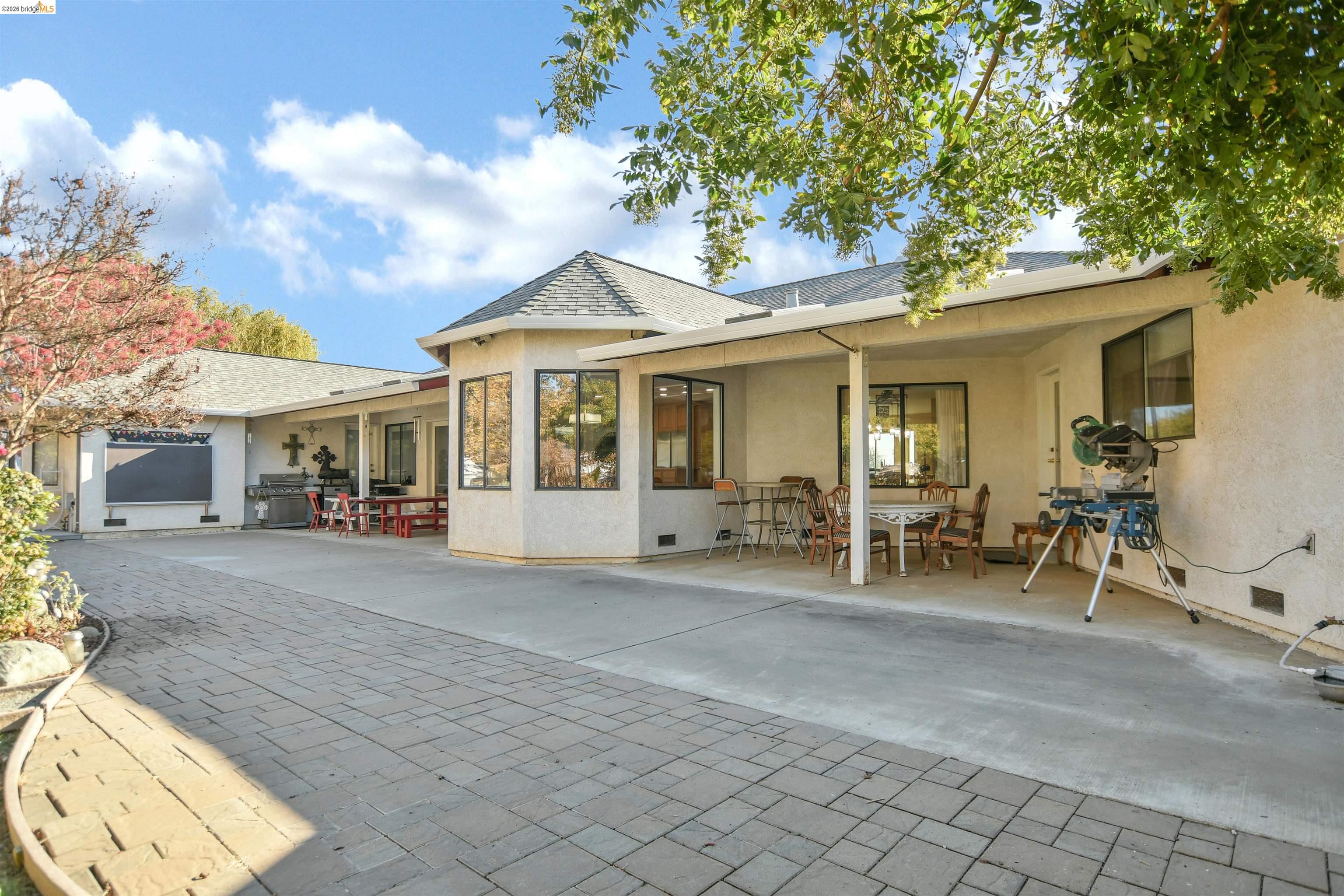 23751 Marsh Creek Road Brentwood, CA 94513 - Photo 40 of 49 a view of a house with backyard porch and sitting area