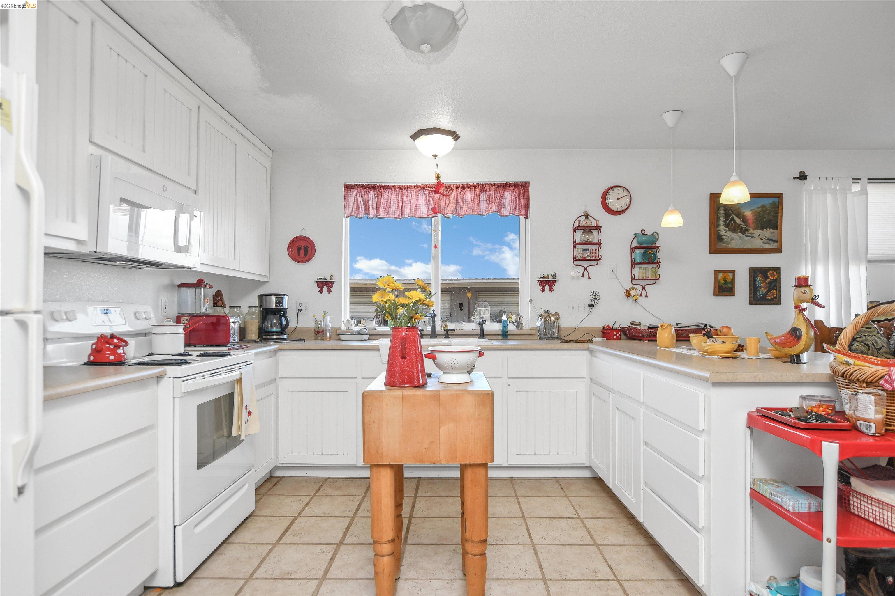 23751 Marsh Creek Road Brentwood, CA 94513 - Photo 43 of 49 a kitchen with a sink cabinets and window