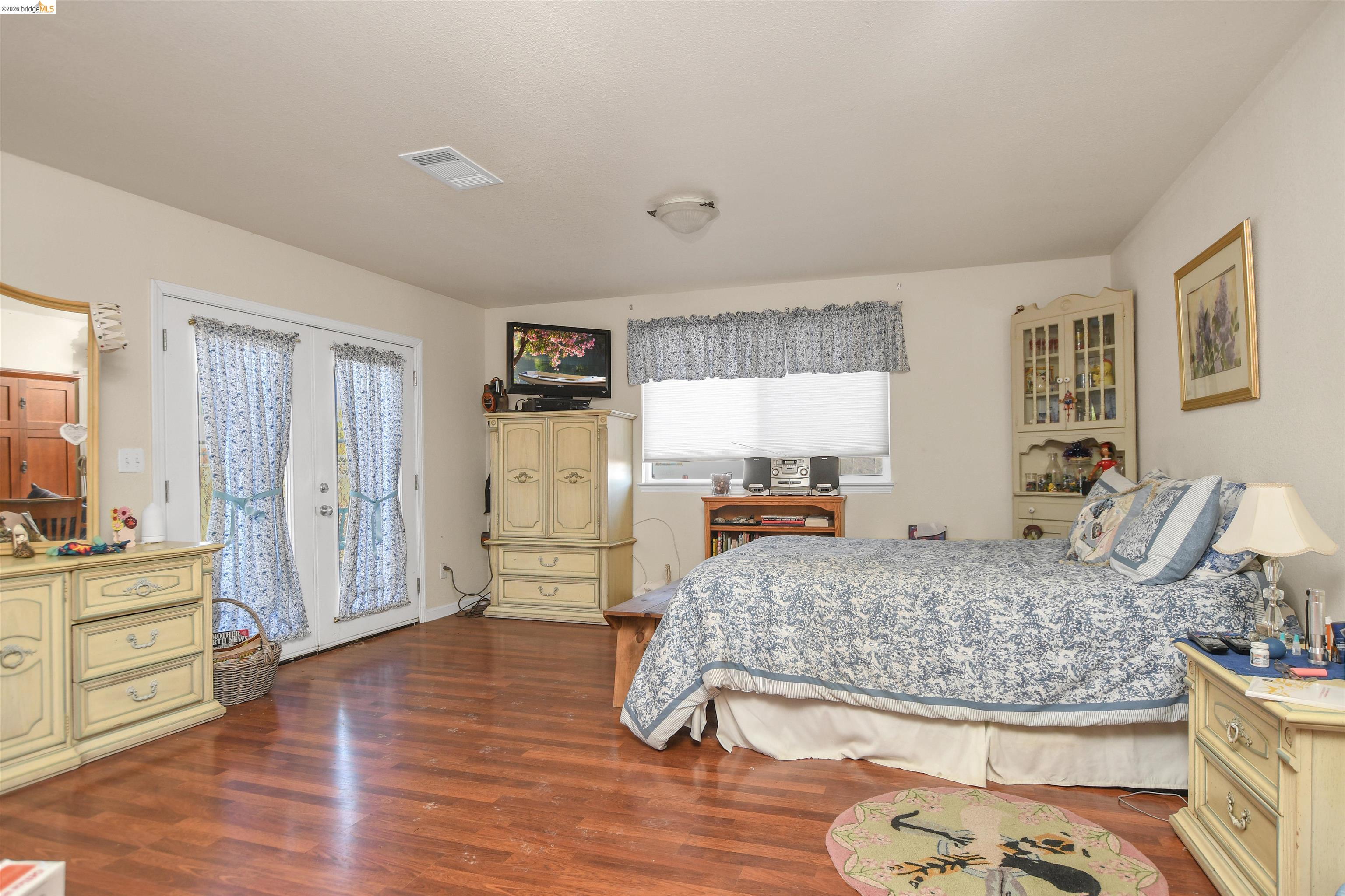 23751 Marsh Creek Road Brentwood, CA 94513 - Photo 46 of 49 a living room with furniture and a wooden floor