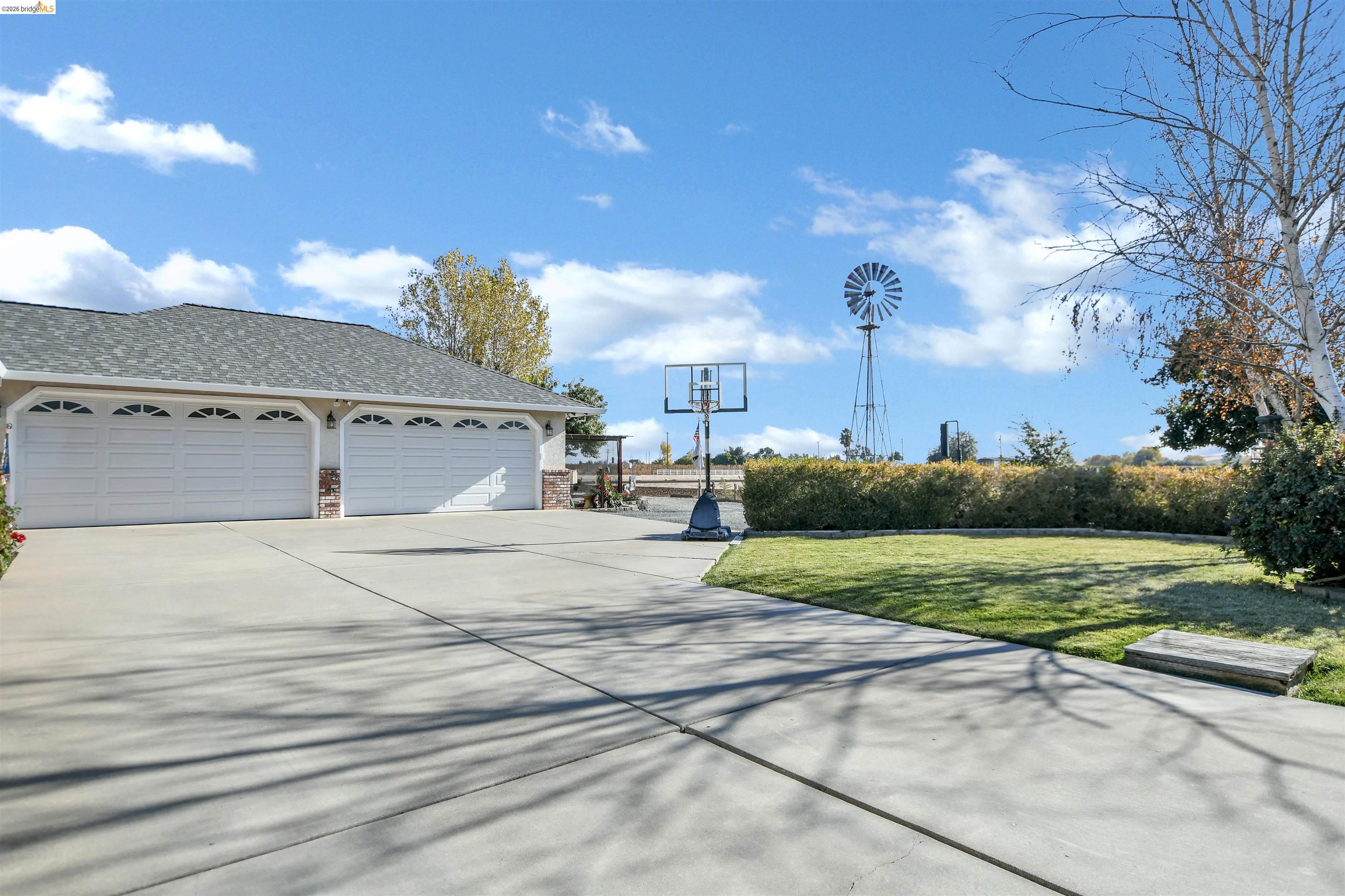 23751 Marsh Creek Road Brentwood, CA 94513 - Photo 10 of 49 a view of a parking space and a car parked