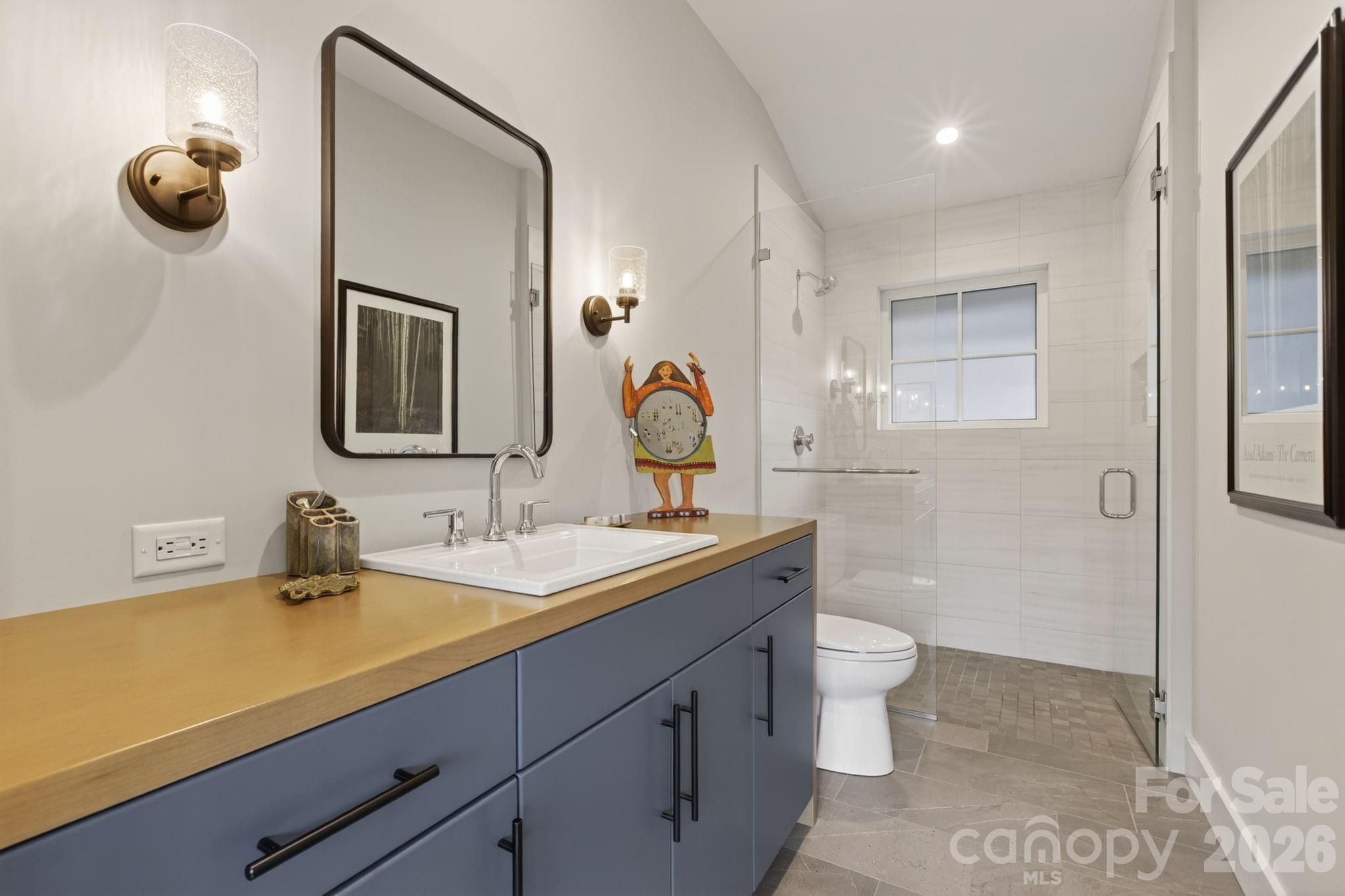 18 Wordsworth Road Black Mountain, NC 28711 - Photo 16 of 23 a bathroom with a toilet sink double vanity and mirror
