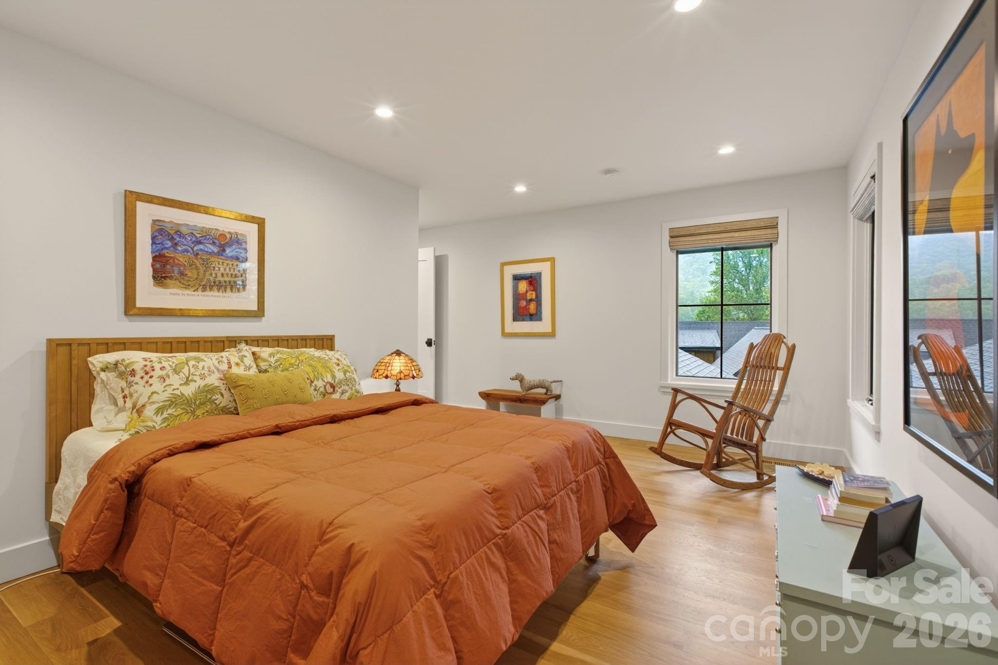 18 Wordsworth Road Black Mountain, NC 28711 - Photo 17 of 23 a bedroom with a bed and wooden floor