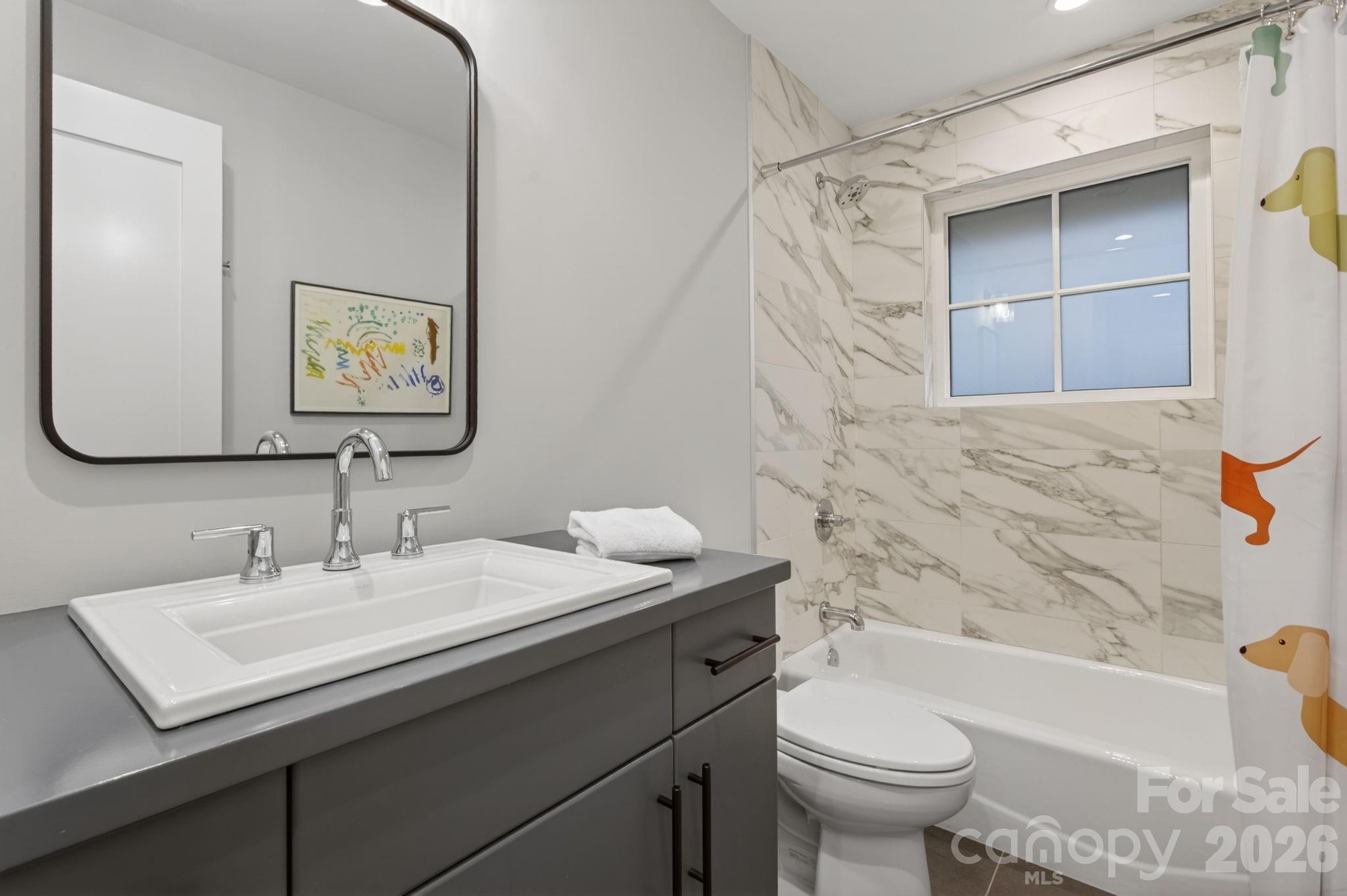 18 Wordsworth Road Black Mountain, NC 28711 - Photo 18 of 23 a bathroom with a sink a toilet and bathtub