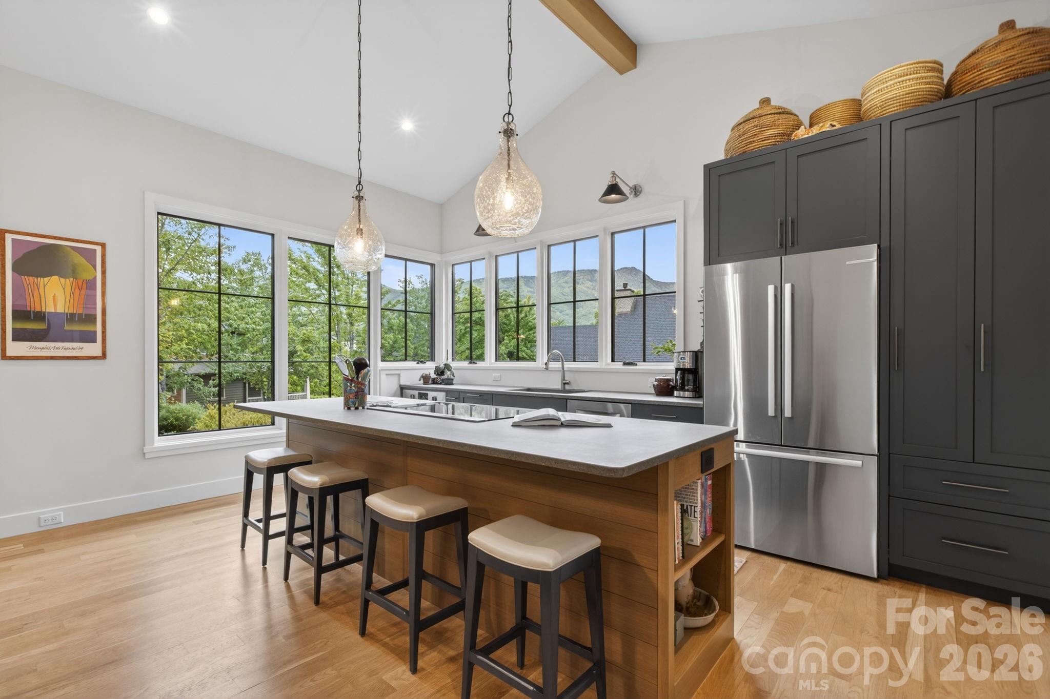 18 Wordsworth Road Black Mountain, NC 28711 - Photo 5 of 23 a kitchen with kitchen island a large counter top space appliances and cabinets