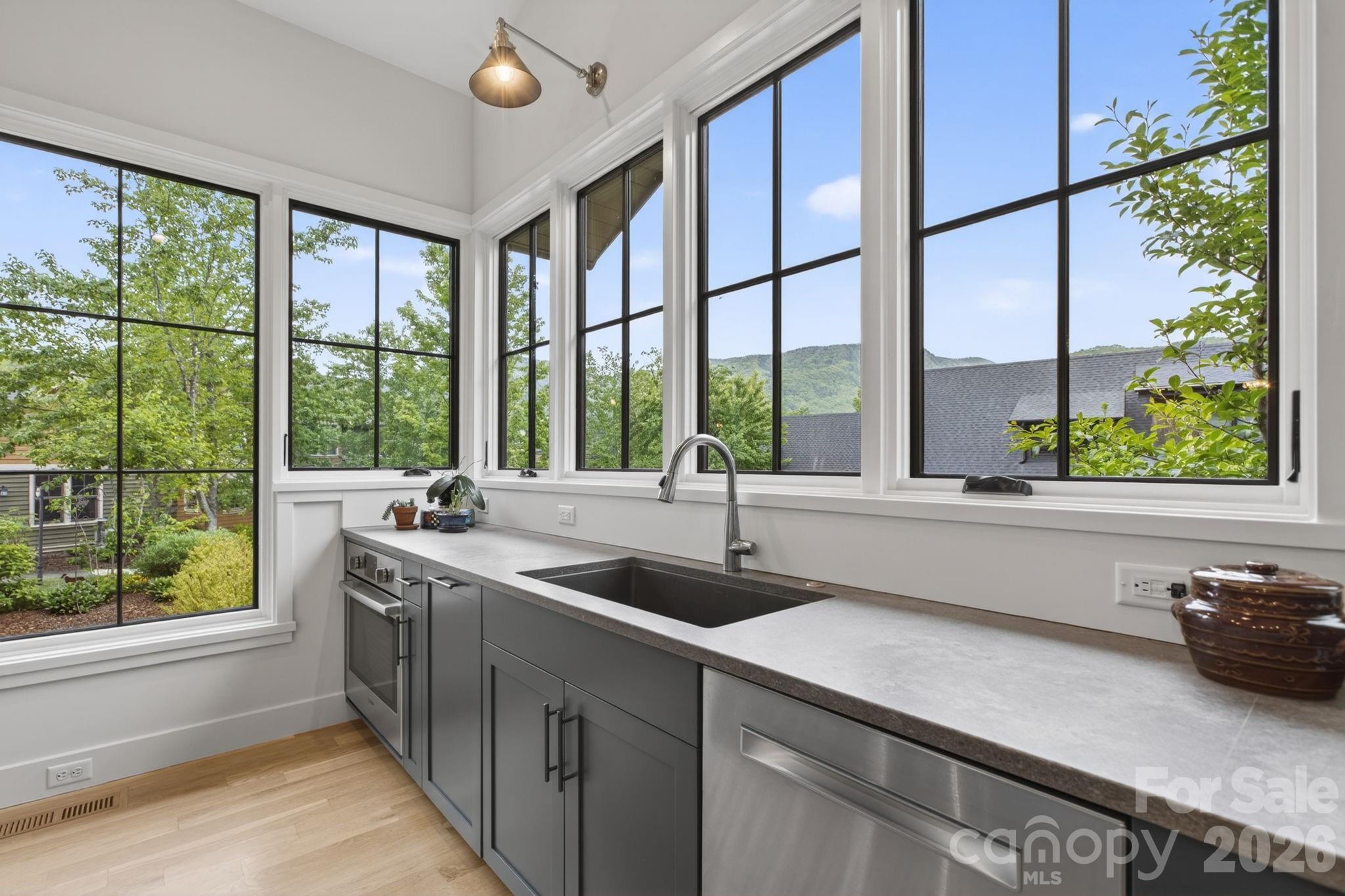 18 Wordsworth Road Black Mountain, NC 28711 - Photo 7 of 23 a kitchen with a sink and large window
