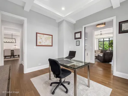 a living room with furniture kitchen view and a potted plant
