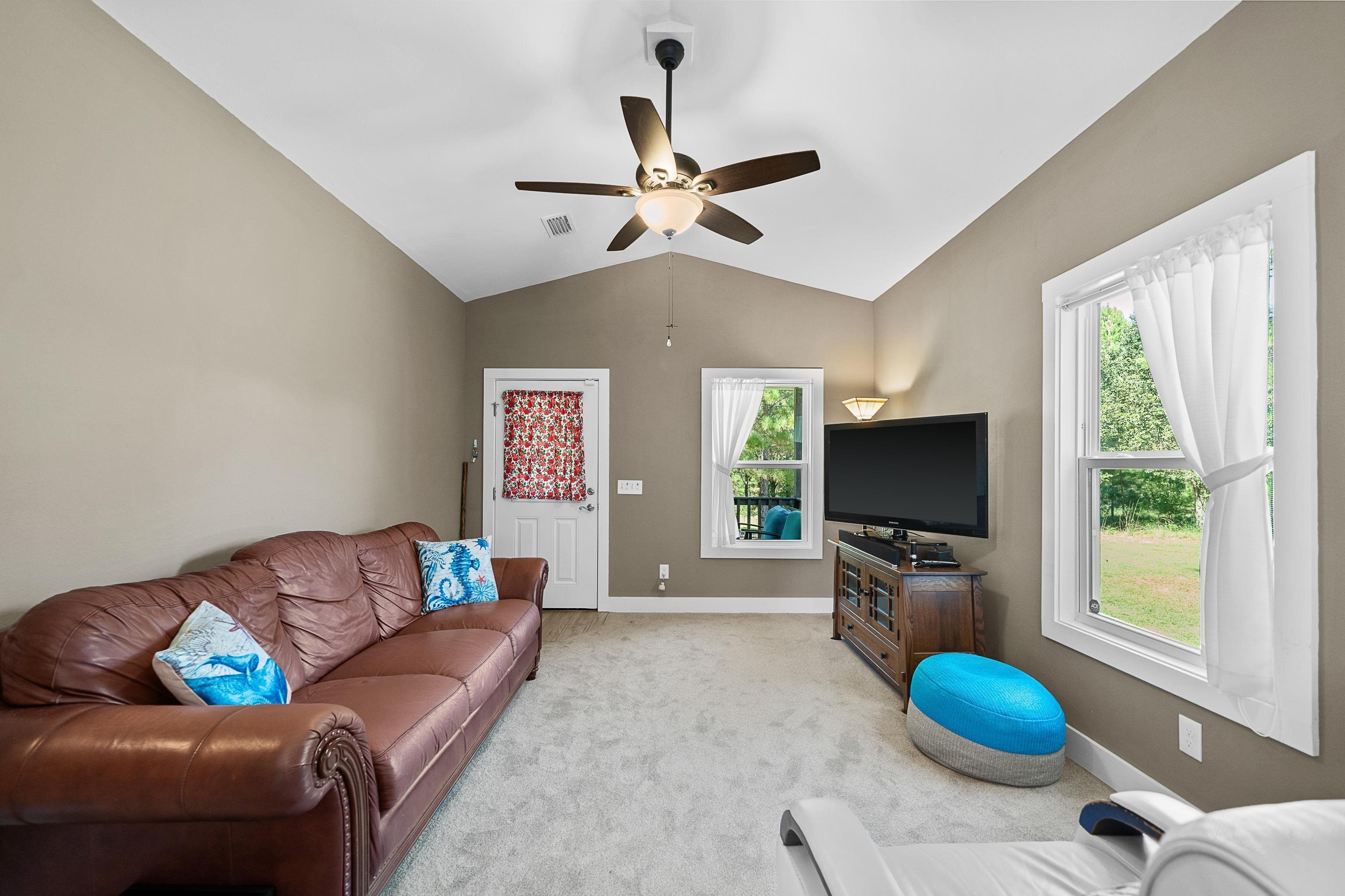 24616 Bretz Lane Elberta, AL 36530 - Photo 14 of 42 Living room with vaulted ceiling and new carpet (2025).