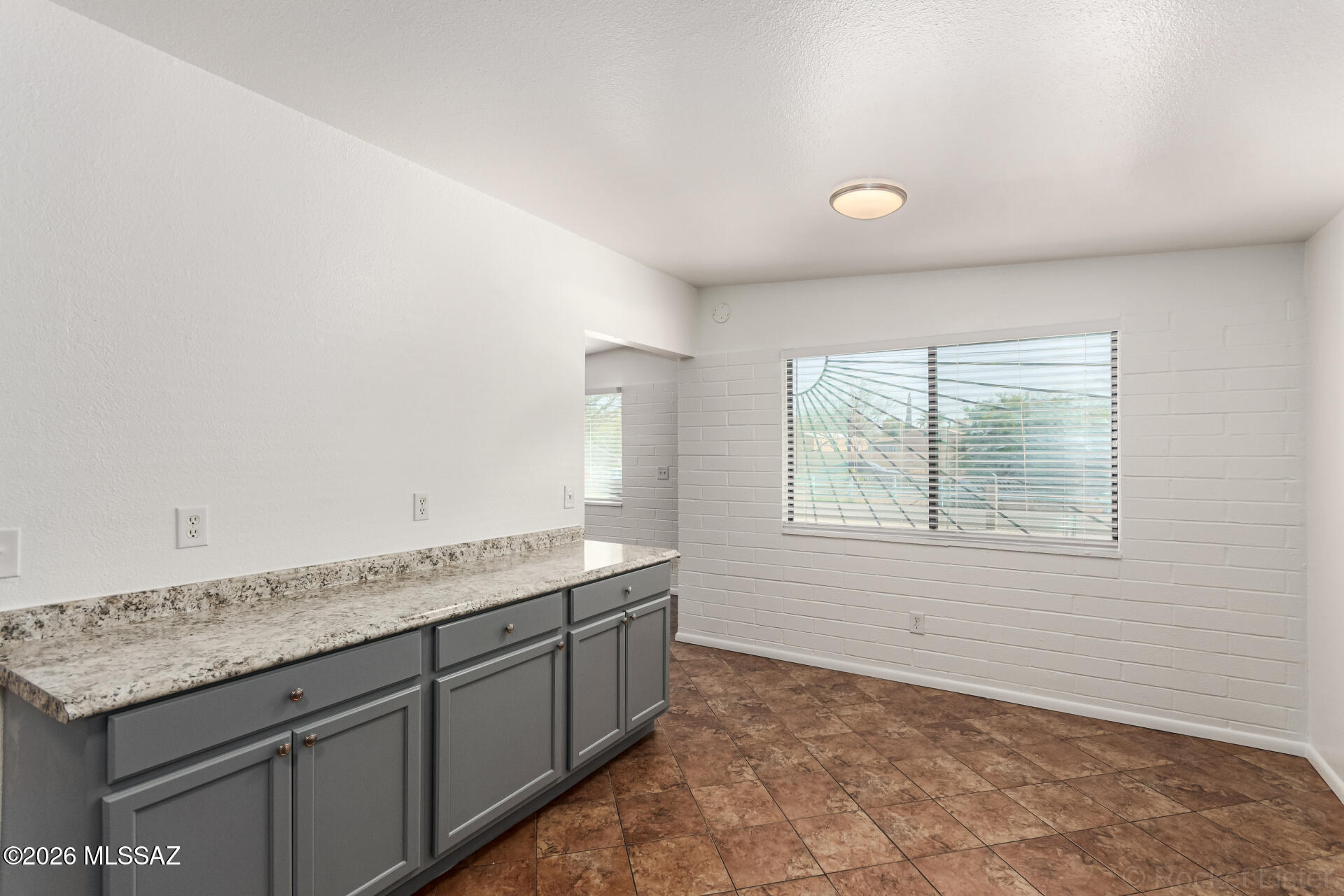 17 East Los Reales Road Tucson, AZ 85756 - Photo 6 of 27 a view of a kitchen with granite countertop cabinets and a sink
