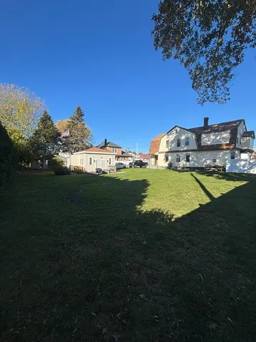 a view of a swimming pool with an outdoor space and seating area